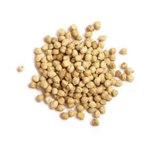 Pile of white peppercorns on a white background