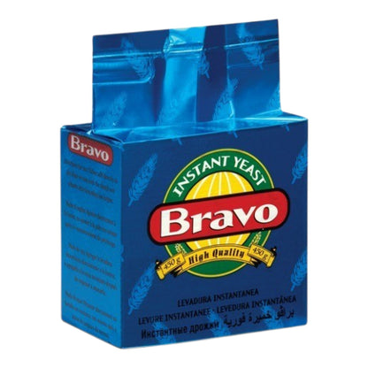 A blue package of Bravo Instant Yeast, featuring the red and white Bravo logo and a green and yellow emblem, shown on a plain white background.
