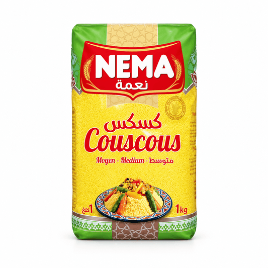 A 1 kg bag of Nema Couscous flour, featuring its signature yellow and green packaging with a red Nema logo and an illustration of prepared couscous with vegetables.
