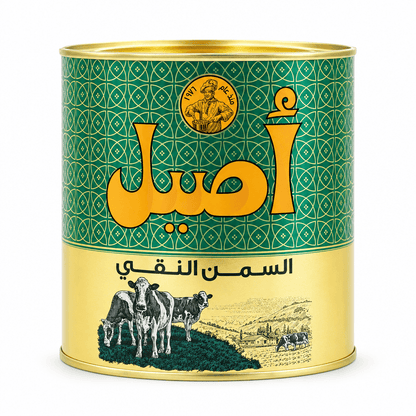 A cylindrical metal can of Egyptian table salt, 'Asad Al-Ahlia', featuring a green and gold label with Arabic text and an illustration of cows on a hillside.