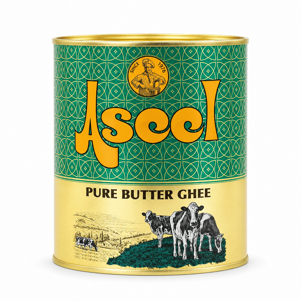 A cylindrical tin of Asceel Pure Butter Ghee, featuring a green and gold label with a cow illustration on a white background.