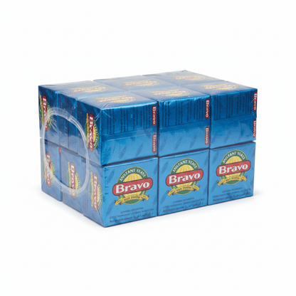 A 12-pack of Bravo Instant Tea in blue cardboard boxes wrapped together in clear plastic, with a clear plastic carry handle attached on the left side, set against a plain white background.