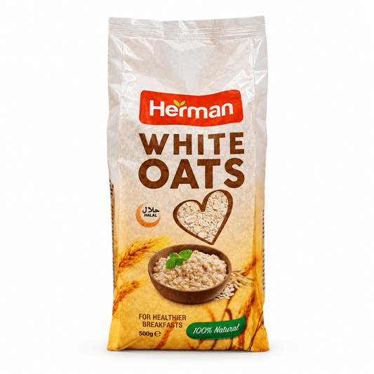 A 500g bag of Herman White Oats on a plain white background. The packaging is beige with a prominent red 'Herman' logo, brown 'WHITE OATS' text, and an illustration of a bowl of oatmeal with a wheat heart.