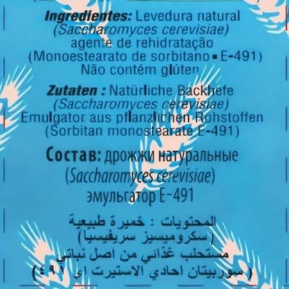 A blue product information card with white text in German and Arabic listing ingredients for natural dry yeast (Saccharomyces cerevisiae) and emulsifier E-491, with tropical palm leaf illustrations.