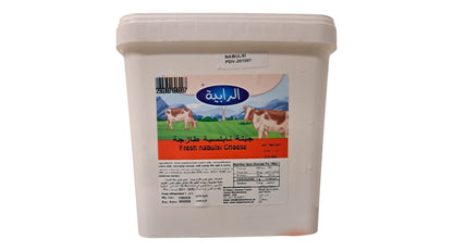 A white plastic tub of Fresh nabusi Cheese by the brand Al Rabie, featuring a colorful label with cows and a green field.