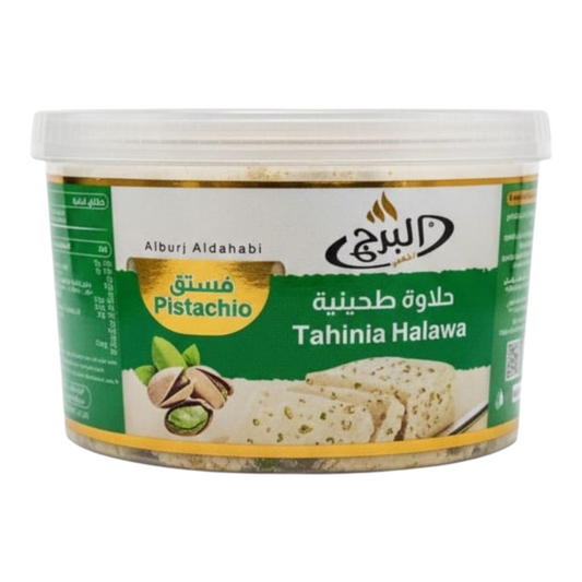 Container of Alburj Al Dahabi Tahinia Halawa with pistachio flavor on a white background