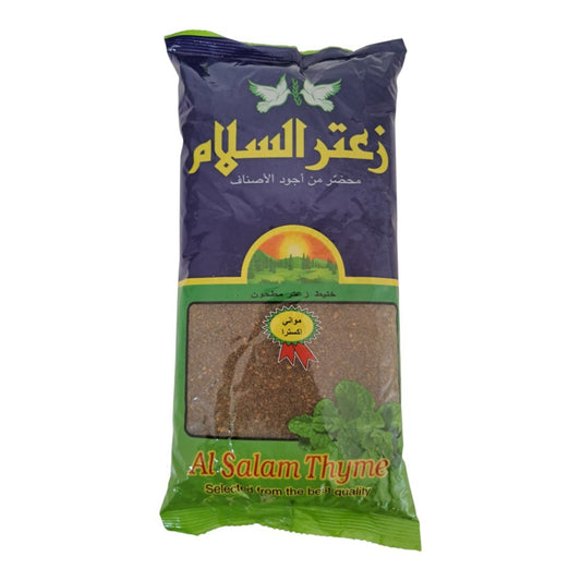 A package of Al-Salam Thyme (Salam Zaitun) in a green and dark purple bag with a clear window showing the brown dried thyme inside.