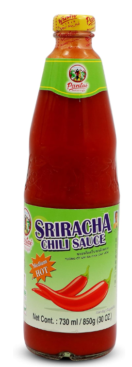 Bottle of sriracha chili sauce with a green label on a white background